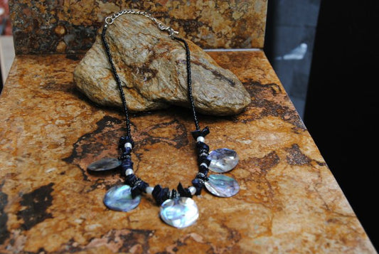 Handmade Silver Seashell Necklace in Black. We also have a Brown Necklace available. You will exactly the one pictured.