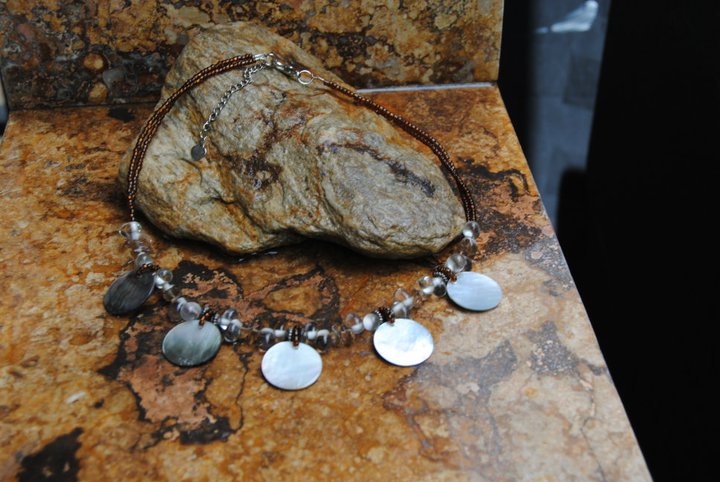 Handmade Silver Seashell Necklace in Black. We also have a Brown Necklace available. You will exactly the one pictured.